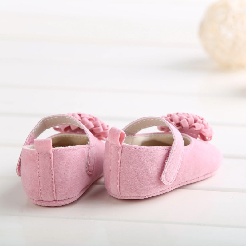 Red baby shoes from eprolo's Princess Series with soft bottom, designed for comfortable steps for infants.